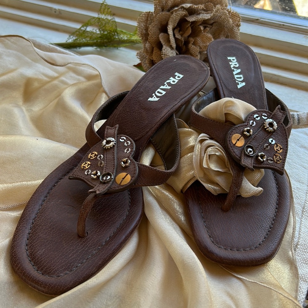 Prada low heeled sandals in excellent condition. Steampunk heart design